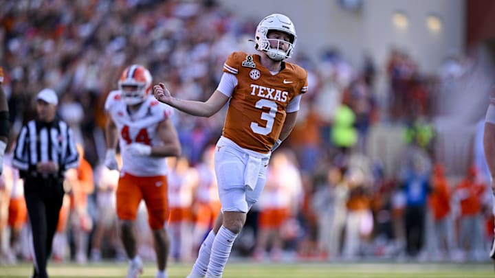 Texas Longhorns quarterback Quinn Ewers celebrates after he throws a touchdown pass against the Clemson Tigers. Texas Longhorns quarterback Quinn Ewers celebrates after he throws a touchdown pass against the Clemson Tigers.