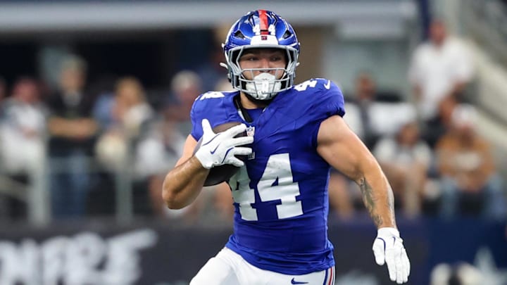 Sep 14, 2025; Arlington, Texas, USA;  New York Giants running back Cam Skattebo (44) runs during the game against the Dallas Cowboys at AT&T Stadium. 