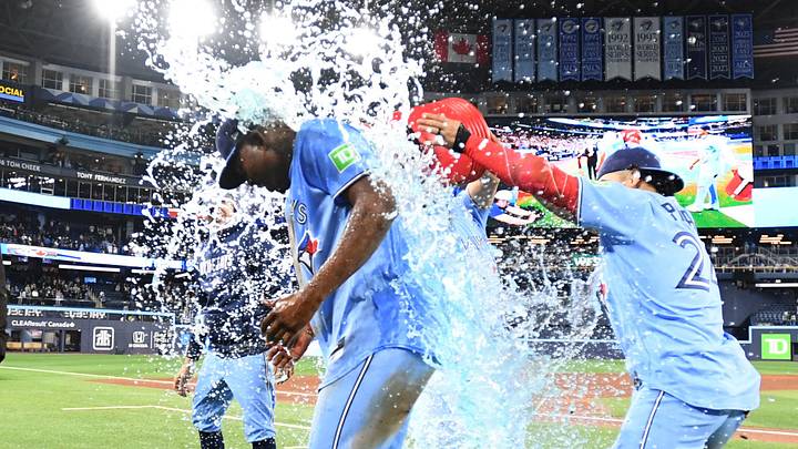 Toronto Blue Jays right fielder Jesus Sanchez (12) is doused with ice water by teammates as they celebrate a win. Toronto Blue Jays right fielder Jesus Sanchez (12) is doused with ice water by teammates as they celebrate a win.