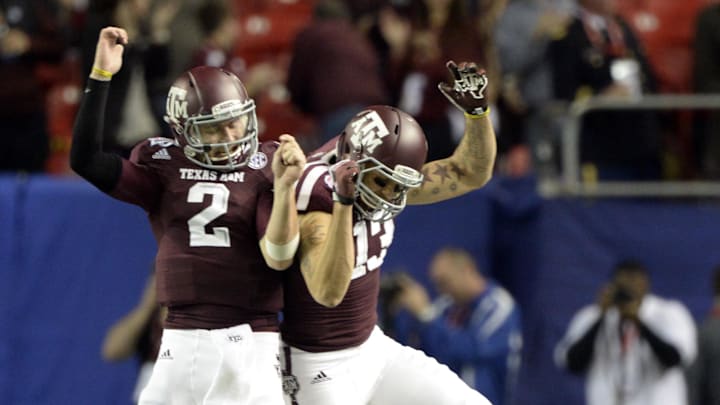 Dec 31, 2013; Atlanta, GA, USA;  Texas A&M Aggies quarterback Johnny Manziel (2) celebrates with wide receiver Mike Evans (13) in the fourth quarter against the Duke Blue Devils in the 2013 Chick-fil-a Bowl at the Georgia Dome. Mandatory Credit: John David Mercer-Imagn Images