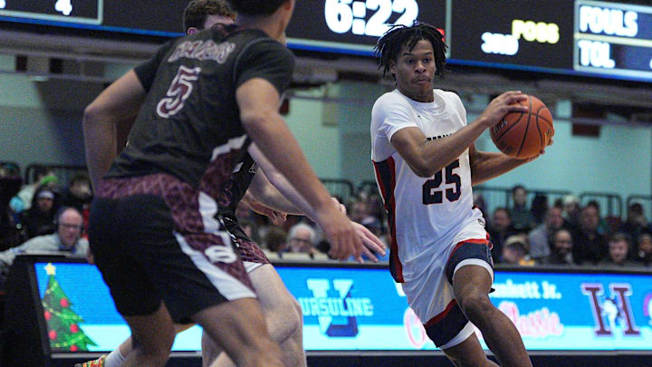 Stepinac's Jasiah Jervis (25) drives to the paint during the William F. Plunkett Jr. Christmas Classic against Scarsdale at Westchester County Center in White Plains on Saturday, December 21, 2024.