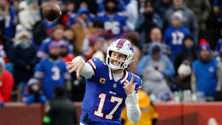 Buffalo Bills quarterback Josh Allen (17) steps into this throw over the middle. Allen only threw