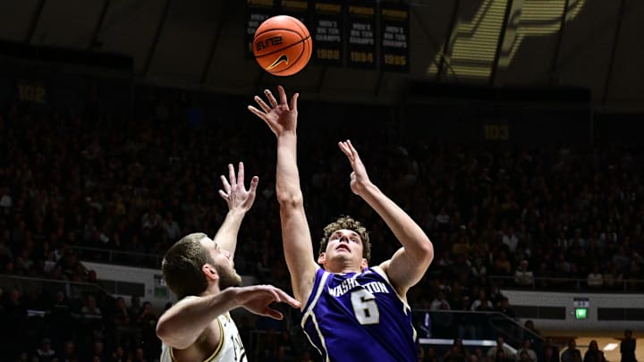 Jan 7, 2026; West Lafayette, Indiana, USA; Washington Huskies forward Hannes Steinbach (6) shoots the ball over Purdue Boilermakers center Oscar Cluff (45) during the first half at Mackey Arena.