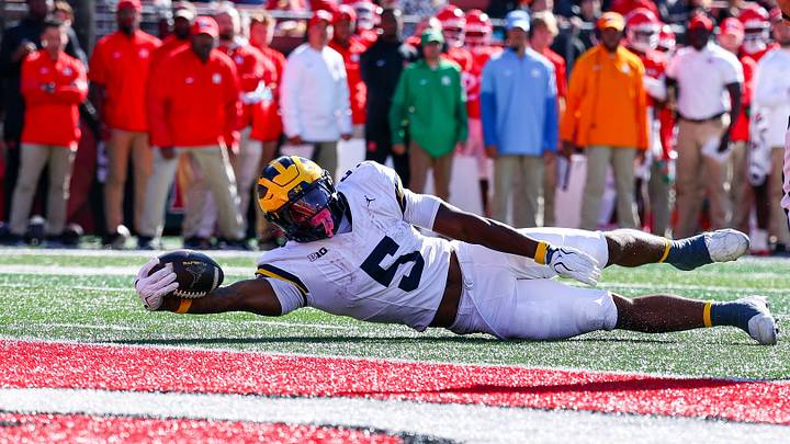 Oct 31, 2026; Piscataway, New Jersey, USA;  Michigan Wolverines running back Savion Hiter (5) reaches for the end zone during the first half against the Rutgers Scarlet Knights at SHI Stadium. Mandatory Credit: Vincent Carchietta-Imagn Images