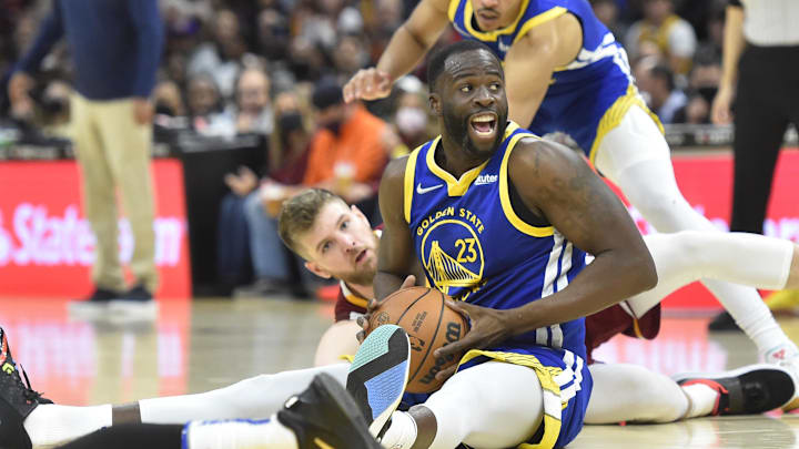 Golden State Warriors forward Draymond Green (23) looks to pass in the third quarter against the Cleveland Cavaliers at Rocket Mortgage FieldHouse. Mandatory Credit: David Richard-Imagn Images