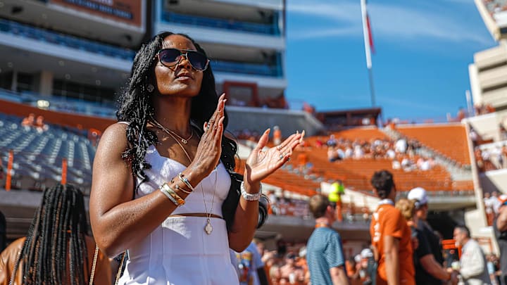Loreal Sarkisian, wife of Texas head coach Steve Sarkisian, watches the team warm up before the game against Texas Tech.