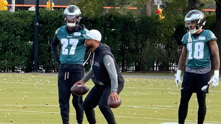 Jaire Alexander (right) works with Quinyon Mitchell (left) and DB coach Christian Parker during Friday's practice as the Eagles prepare to travel to Green Bay for Monday Night Football.