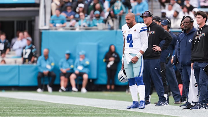  Dallas Cowboys quarterback Dak Prescott looks on from the sideline during the game against the Carolina Panthers.