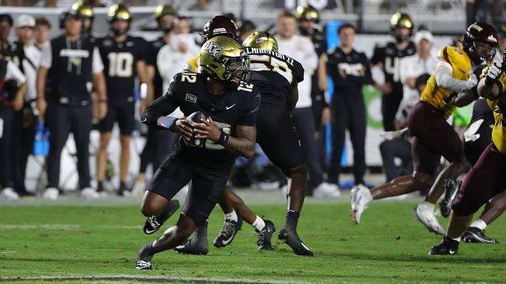 Sep 3, 2026; Orlando, Florida, USA; Central Florida quarterback Keyone Jenkins (12) runs in the pocket during the third quarter against Bethune-Cookman at Acrisure Bounce House. Mandatory Credit: Mike Watters-Imagn Images Sep 3, 2026; Orlando, Florida, USA; Central Florida quarterback Keyone Jenkins (12) runs in the pocket during the third quarter against Bethune-Cookman at Acrisure Bounce House. Mandatory Credit: Mike Watters-Imagn Images
