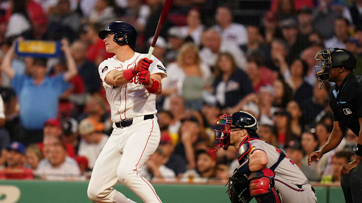 Jun 4, 2024; Boston, Massachusetts, USA; Boston Red Sox right fielder Bobby Dalbec (29) gets a base hit to drive in two runs against the Atlanta Braves in the fourth inning at Fenway Park. Mandatory Credit: David Butler II-Imagn Images