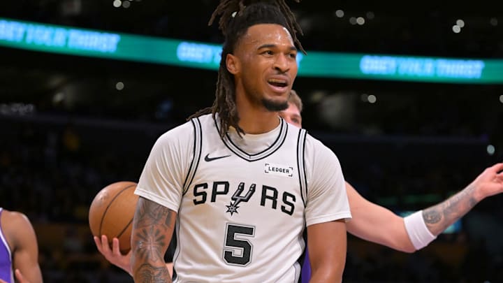 Dec 10, 2025; Los Angeles, California, USA;  San Antonio Spurs guard Stephon Castle (5) reacts after a basket and a foul called on Los Angeles Lakers guard Luka Doncic (77) during the first half at Crypto.com Arena. Mandatory Credit: Jayne Kamin-Oncea-Imagn Images