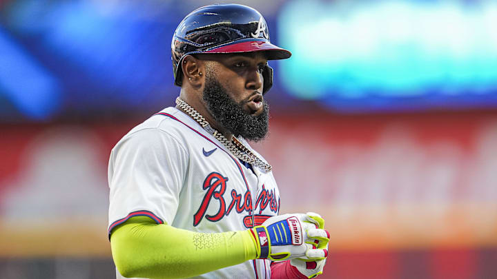 Apr 21, 2024; Cumberland, Georgia, USA; Atlanta Braves designated hitter Marcell Ozuna (20) reacts after hitting a three run home run against the Texas Rangers during the first inning at Truist Park.