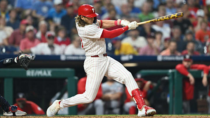 Aug 17, 2024; Philadelphia, Pennsylvania, USA; Philadelphia Phillies infielder Alec Bohm (28) hits an RBI single against the Washington Nationals in the sixth inning at Citizens Bank Park.