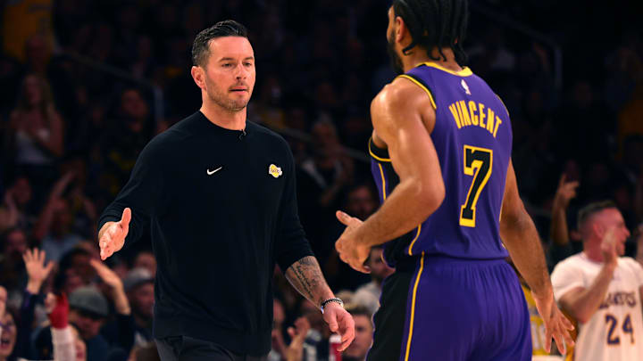  Los Angeles Lakers head coach JJ Redick celebrates with guard Gabe Vincent (7) during the fourth quarter against the LA Clippers at Crypto.com Arena.