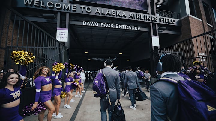 UW players arrive at Husky Stadium before the Michigan game. 