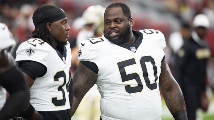 Aug 10, 2024; Glendale, Arizona, USA; New Orleans Saints defensive tackle Khalen Saunders (50) with cornerback Kool-Aid McKinstry (34) against the Arizona Cardinals during a preseason NFL game at State Farm Stadium. Mandatory Credit: Mark J. Rebilas-Imagn Images Aug 10, 2024; Glendale, Arizona, USA; New Orleans Saints defensive tackle Khalen Saunders (50) with cornerback Kool-Aid McKinstry (34) against the Arizona Cardinals during a preseason NFL game at State Farm Stadium. Mandatory Credit: Mark J. Rebilas-Imagn Images