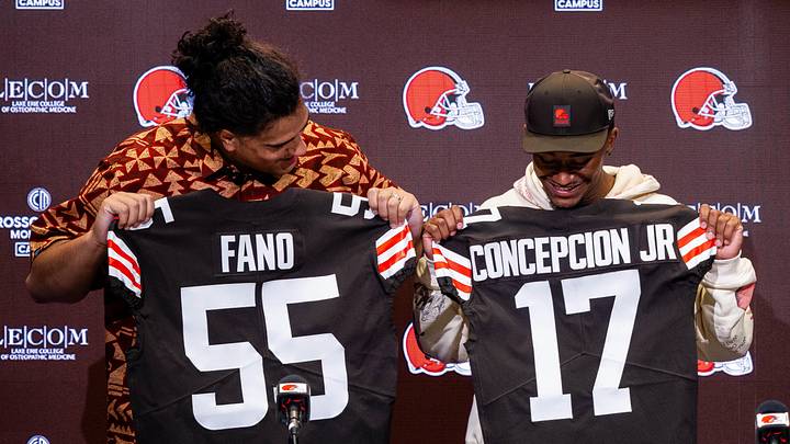 Apr 24, 2026; Berea, OH, USA; Cleveland Browns first round draft picks Spencer Fano, left, and KC Concepcion hold their new jerseys during an introductory press conference at CrossCountry Mortgage Campus. Mandatory Credit: Ken Blaze-Imagn Images