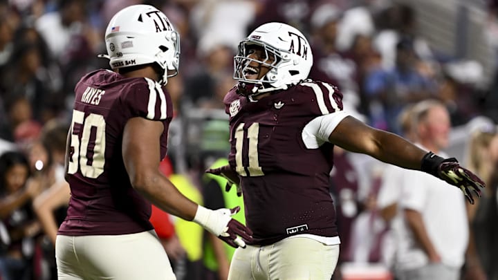 Oct 11, 2025; College Station, Texas, USA; Texas A&M Aggies defensive tackle Tyler Onyedim (11) and defensive end Dayon Hayes (50) react during the fourth quarter against the Florida Gators at Kyle Field. Mandatory Credit: Maria Lysaker-Imagn Images 