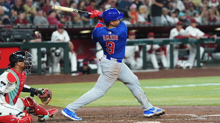 Mar 27, 2025; Phoenix, Arizona, USA; Chicago Cubs catcher Miguel Amaya (9) hits a three RBI double against the Arizona Diamondbacks during the fifth inning at Chase Field. Mandatory Credit: Joe Camporeale-Imagn Images