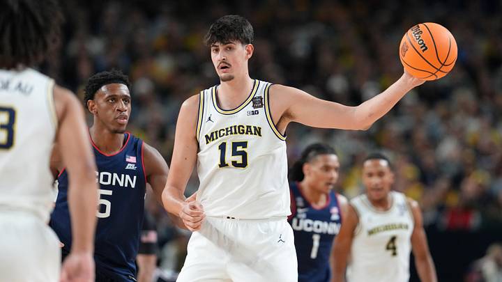 Apr 6, 2026; Indianapolis, IN, USA; Michigan Wolverines center Aday Mara (15) controls the ball against the UConn Huskies during the first half in the national championship of the Final Four of the men's 2026 NCAA Tournament between the  and the Michigan Wolverines at Lucas Oil Stadium. Mandatory Credit: Bob Donnan-Imagn Images