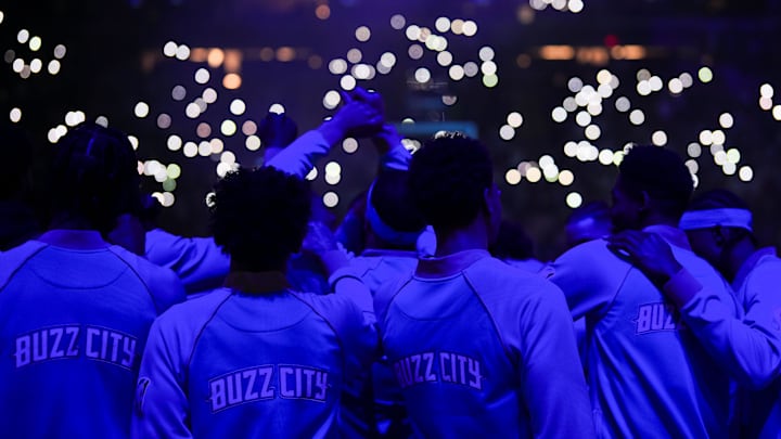 Charlotte Hornets players huddle before a game against the Minnesota Timberwolves at Target Center.