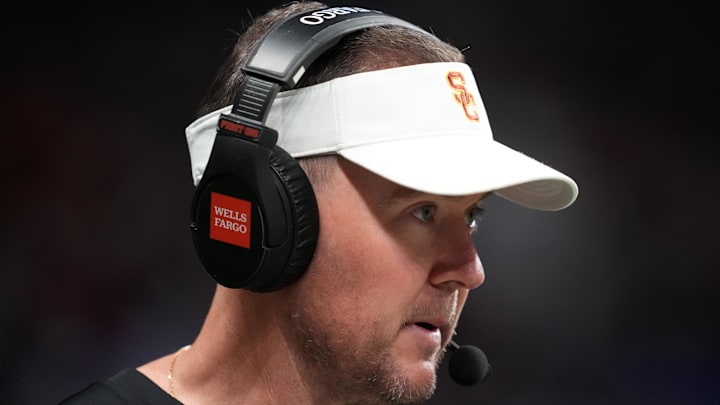 Dec 30, 2025; San Antonio, TX, USA; Southern California Trojans head coach Lincoln Riley watches in the first half against the TCU Horned Frogs during the Alamo Bowl at Alamodome. Mandatory Credit: Kirby Lee-Imagn Images