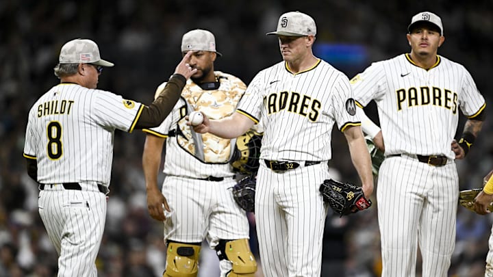 May 16, 2025; San Diego, California, USA; San Diego Padres manager Mike Shildt (8) signals for a new pitcher as pitcher Stephen Kolek (32) leaves the game during sixth inning against the Seattle Mariners at Petco Park. Mandatory Credit: Denis Poroy-Imagn Images