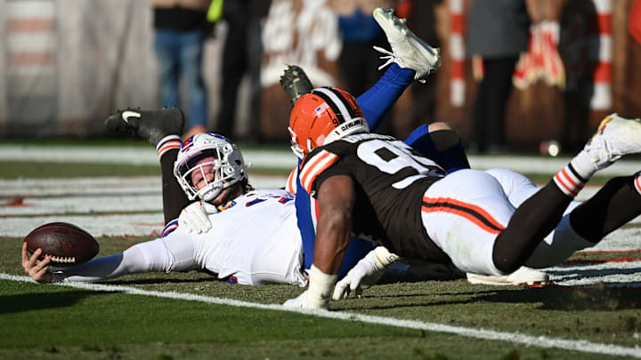 Dec 21, 2025; Cleveland, Ohio, USA;  Buffalo Bills quarterback Josh Allen (17) is sacked by Cleveland Browns defensive tackle Mason Graham (94) during the first half at Huntington Bank Field.