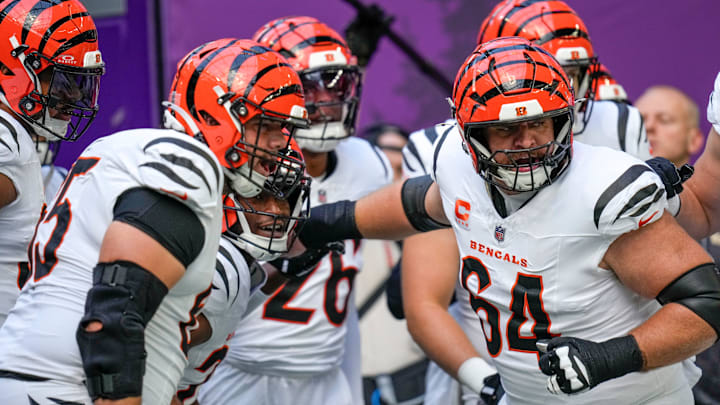 Cincinnati Bengals center Ted Karras (64) leads onto the field during warmups before the first quarter of the NFL Week 3 game between the Minnesota Vikings and the Cincinnati Bengals at U.S. Bank Stadium in Minneapolis on Sunday, Sept. 21, 2025.