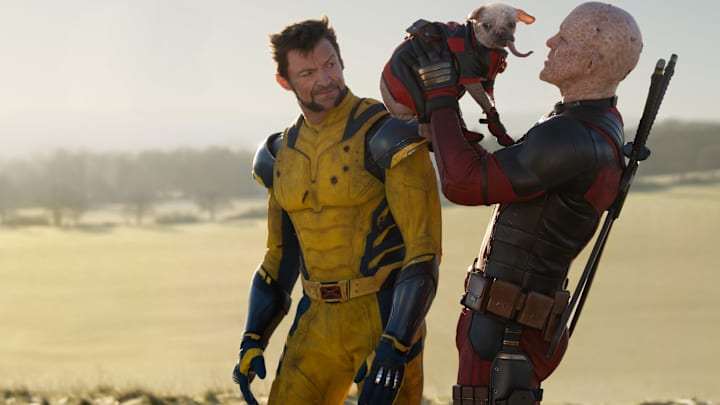 (L-R): Hugh Jackman as Wolverine/Logan, Dogpool, and Ryan Reynolds as Deadpool/Wade Wilson in 20th Century Studios/Marvel Studios' DEADPOOL & WOLVERINE. Photo by Jay Maidment. © 2024 20th Century Studios / © and ™ 2024 MARVEL.