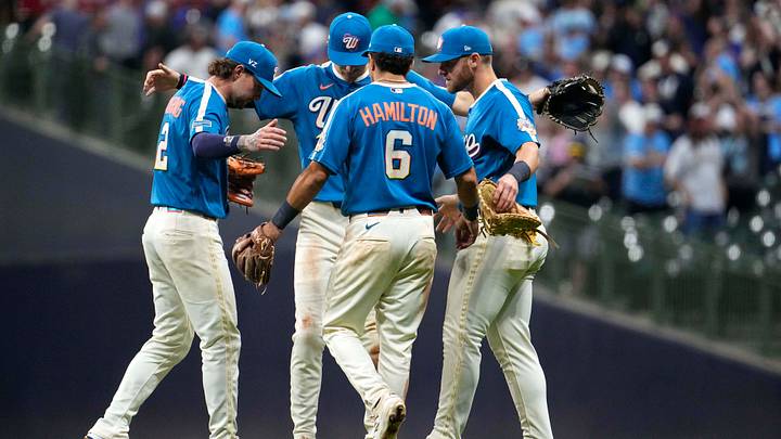 Jun 26, 2026; Milwaukee, Wisconsin, USA; Milwaukee Brewers second baseman Brice Turang (2), shortstop Cooper Pratt (12),  first baseman Jake Bauers (9), and   third baseman David Hamilton (6) celebrate a 6-2 win over the Chicago Cubs at American Family Field. Mandatory Credit: Michael McLoone-Imagn Images