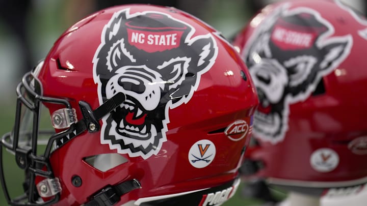 Dec 30, 2022; Charlotte, NC, USA; North Carolina State Wolfpack helmets during the first half against the Maryland Terrapins in the 2022 Duke's Mayo Bowl at Bank of America Stadium. Mandatory Credit: Jim Dedmon-Imagn Images Dec 30, 2022; Charlotte, NC, USA; North Carolina State Wolfpack helmets during the first half against the Maryland Terrapins in the 2022 Duke's Mayo Bowl at Bank of America Stadium. Mandatory Credit: Jim Dedmon-Imagn Images