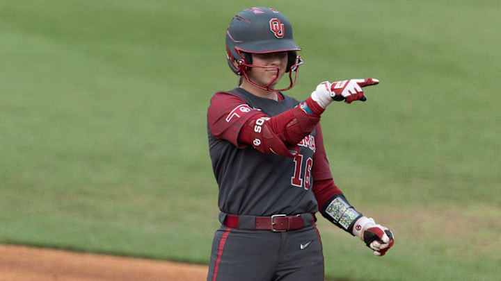 Oklahoma outfielder Abby Dayton celebrates a single. Oklahoma outfielder Abby Dayton celebrates a single.