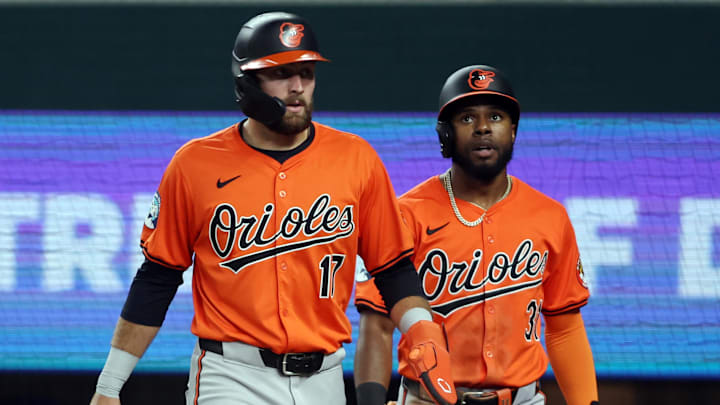 Jul 20, 2024; Arlington, Texas, USA; Baltimore Orioles left fielder Colton Cowser (17) and center fielder Cedric Mullins (31) walk back to the dugout after scoring runs against the Texas Rangers in the second inning at Globe Life Field.
