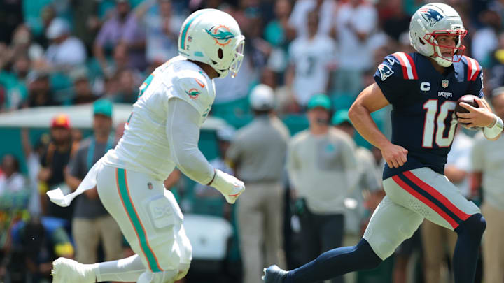 Sep 14, 2025; Miami Gardens, Florida, USA; Miami Dolphins linebacker Bradley Chubb (2) pursues New England Patriots quarterback Drake Maye (10) at Hard Rock Stadium.