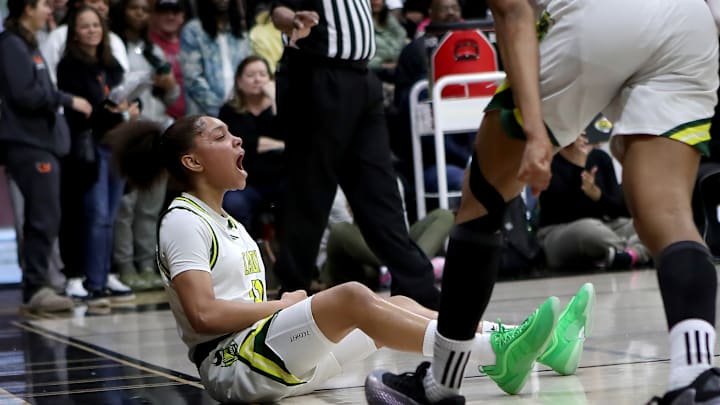 Game MVP Kaleena Smith reacts to an AND ONE layup and free throw as part of a 21-4 run to end the Ontario Christian's 61-44 victory over Archbishop Mitty Saturday at the 4th Sabrina Ionescu Showcase at Carondelet High School in Concord, Calif. The victory avenged a 25-point loss two weeks ago to Mitty, which lost its 5-star recruit McKenna Woliczko late in the second quarter to a knee injury. She never returned. Game MVP Kaleena Smith reacts to an AND ONE layup and free throw as part of a 21-4 run to end the Ontario Christian's 61-44 victory over Archbishop Mitty Saturday at the 4th Sabrina Ionescu Showcase at Carondelet High School in Concord, Calif. The victory avenged a 25-point loss two weeks ago to Mitty, which lost its 5-star recruit McKenna Woliczko late in the second quarter to a knee injury. She never returned.