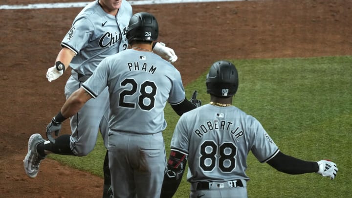 Jun 15, 2024; Phoenix, Arizona, USA; Chicago White Sox first base Andrew Vaughn (25) slaps hands with Chicago White Sox outfielder Tommy Pham (28) and Chicago White Sox outfielder Luis Robert Jr. (88) after hitting a three run home run against the Arizona Diamondbacks during the fifth inning at Chase Field. Mandatory Credit: Joe Camporeale-USA TODAY Sports Jun 15, 2024; Phoenix, Arizona, USA; Chicago White Sox first base Andrew Vaughn (25) slaps hands with Chicago White Sox outfielder Tommy Pham (28) and Chicago White Sox outfielder Luis Robert Jr. (88) after hitting a three run home run against the Arizona Diamondbacks during the fifth inning at Chase Field. Mandatory Credit: Joe Camporeale-USA TODAY Sports