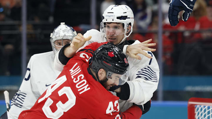 [US, Mexico & Canada customers only] Feb 15, 2026; Milan, Italy; Tom Wilson of Canada clashes with Pierre Crinon of France in men's ice hockey group A play during the Milano Cortina 2026 Olympic Winter Games at Milano Santagiulia Ice Hockey Arena. Mandatory Credit: David W Cerny/Reuters via Imagn Images