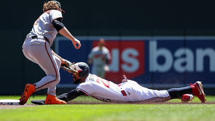 May 8, 2025; Minneapolis, Minnesota, USA; Minnesota Twins center fielder Byron Buxton (25) steals second base as Baltimore Orioles shortstop Gunnar Henderson (2) attempts a tag during the first inning at Target Field. Mandatory Credit: Matt Krohn-Imagn Images May 8, 2025; Minneapolis, Minnesota, USA; Minnesota Twins center fielder Byron Buxton (25) steals second base as Baltimore Orioles shortstop Gunnar Henderson (2) attempts a tag during the first inning at Target Field. Mandatory Credit: Matt Krohn-Imagn Images