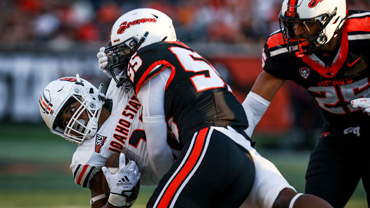 Oregon State Beavers linebacker Dexter Foster (55) takes down Idaho State Bengals running back Dason Brooks (28) during the second half on Saturday, Aug. 31, 2024 at Reser Stadium in Corvallis, Ore.