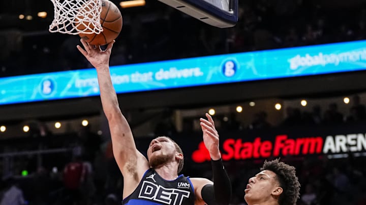 Apr 3, 2024; Atlanta, Georgia, USA; Detroit Pistons guard Malachi Flynn (14) goes to the basket past