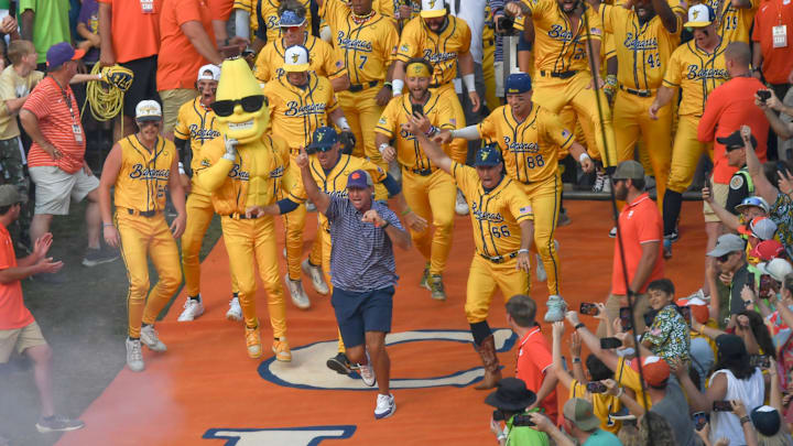Clemson football Head Coach Dabo Swinney surprises the crowd, running down the hill ahead of the Savannah Bananas before a game before 81,000 fans with the Party Animals at Memorial Stadium in Clemson, S.C. Saturday, April 26, 2025.