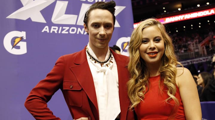 NBC correspondents Tara Lipinski (right) and Johnny Weir (left) in attendance during media day for Super Bowl XLIX at US Airways Center.
