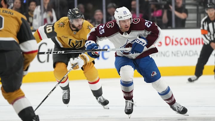 Oct 9, 2024; Las Vegas, Nevada, USA; Colorado Avalanche right wing Logan O’Connor (25) skates ahead of Vegas Golden Knights center Nicolas Roy (10) during the first period at T-Mobile Arena. Mandatory Credit: Lucas Peltier-Imagn Images