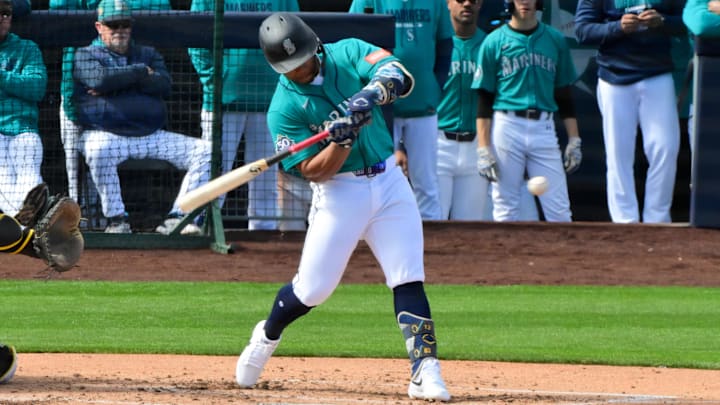 Feb 20, 2026; Peoria, Arizona, USA; Seattle Mariners shortstop Michael Arroyo (96) hits a two-run home run in the second inning against the San Diego Padres during a Spring Training game at Peoria Sports Complex. Mandatory Credit: Matt Kartozian-Imagn Images