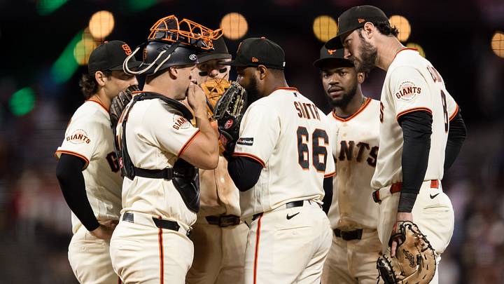 Sep 7, 2026; San Francisco, California, USA;  San Francisco Giants pitcher Dylan Smith (66) talks with catcher Andrew Knizner (19) and teammates on the mound during the ninth inning against the St. Louis Cardinals at Oracle Park.  Mandatory Credit: John Hefti-Imagn Images