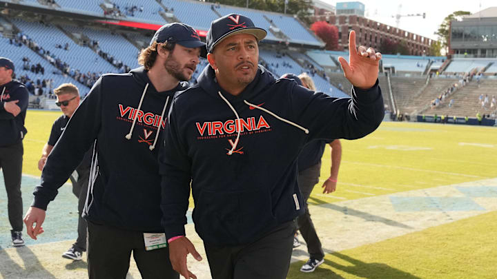 Oct 25, 2025; Chapel Hill, North Carolina, USA; Virginia Cavaliers head coach Tony Elliott runs off the field after defeating the North Carolina Tar Heels in overtime at Kenan Stadium. Mandatory Credit: Bob Donnan-Imagn Images