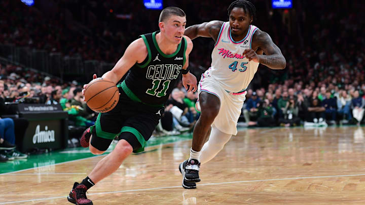 Apr 2, 2025; Boston, Massachusetts, USA; Boston Celtics guard Payton Pritchard (11) controls the ball while Miami Heat guard Davion Mitchell (45) defends during the second half at TD Garden. Mandatory Credit: Bob DeChiara-Imagn Images Apr 2, 2025; Boston, Massachusetts, USA; Boston Celtics guard Payton Pritchard (11) controls the ball while Miami Heat guard Davion Mitchell (45) defends during the second half at TD Garden. Mandatory Credit: Bob DeChiara-Imagn Images