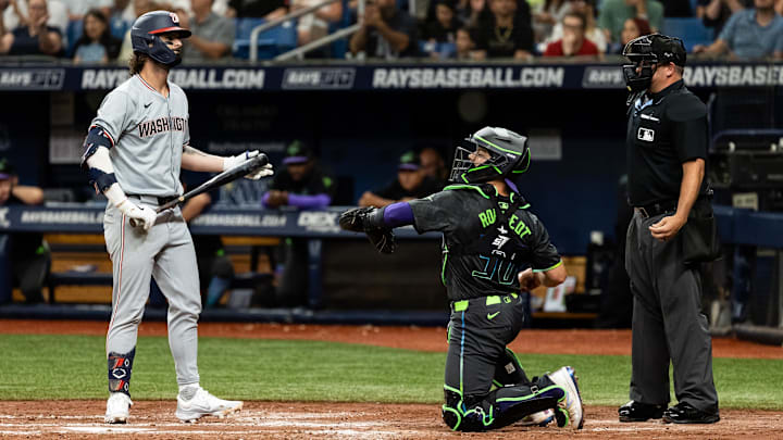 Jun 29, 2024; St. Petersburg, Florida, USA; Washington Nationals outfielder Jesse Winker (6) reacts toward umpire Jeremy Riggs (112) after a strikeout against the Tampa Bay Rays during the third inning at Tropicana Field.