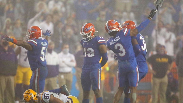 Dec 12, 2020; Gainesville, FL, USA; After a tackle Florida Gators defensive back Marco Wilson (3) throws the shoe of LSU tight end Kole Taylor (87) which resulted in a personal foul penalty against Wilson, during a game against the LSU Tigers at Ben Hill Griffin Stadium in Gainesville, Fla. Dec. 12, 2020. Florida lost 37-34 to the Tigers. Mandatory Credit: Brad McClenny-USA TODAY NETWORK 